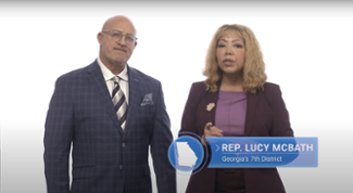 Pictured from left to right: Jim Cantore and Rep. Lucy McBath speak in a Weather Channel public service announcement.