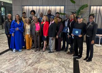 Rep. McBath poses for a picture with Vietnam veterans and their families.